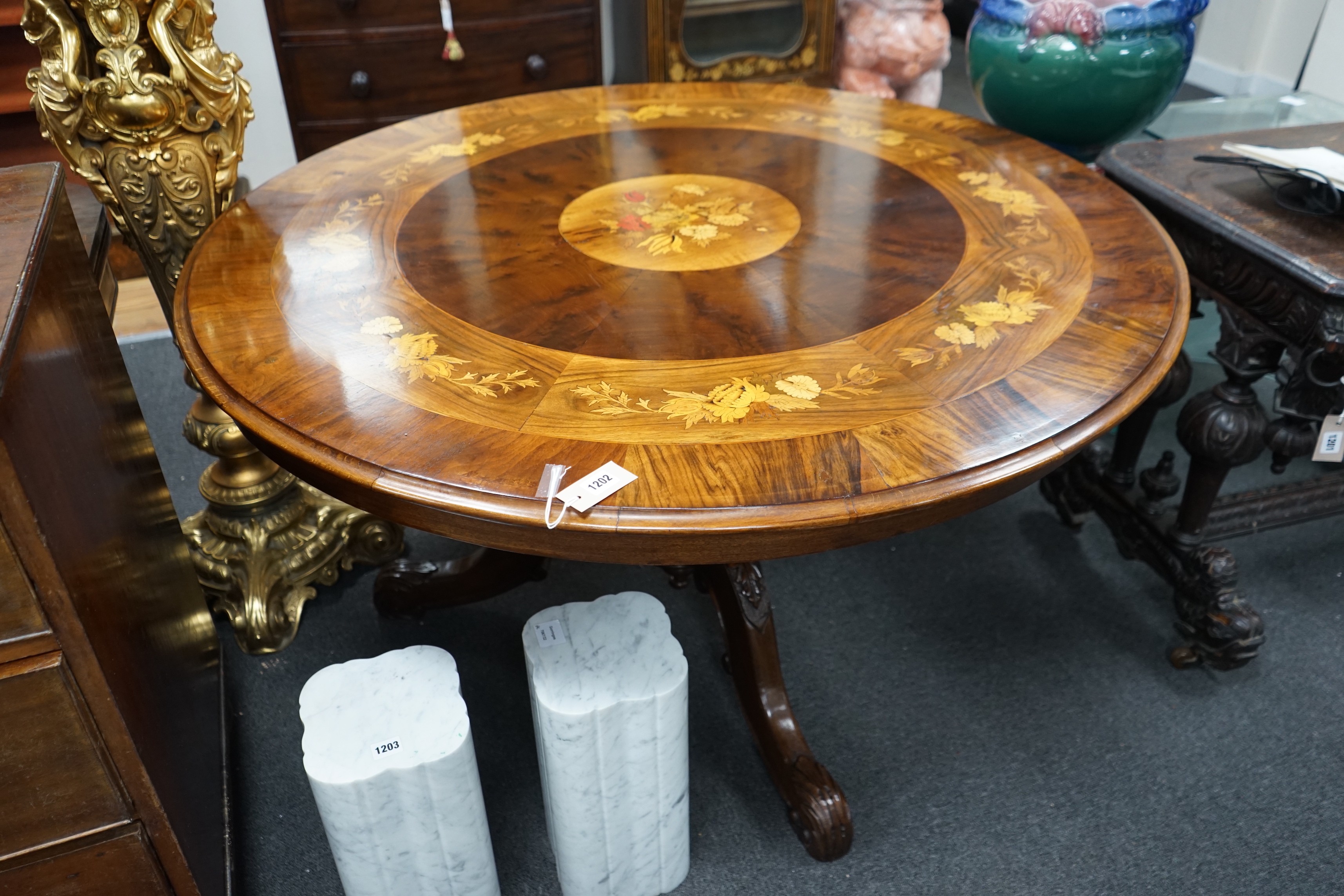 A Victorian style floral marquetry inlaid yew, walnut and rosewood circular breakfast table, diameter 130cm, height 72cm